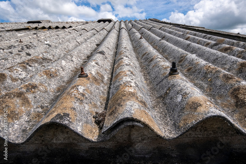 Old roof covering made of corrugated asbestos sheets.