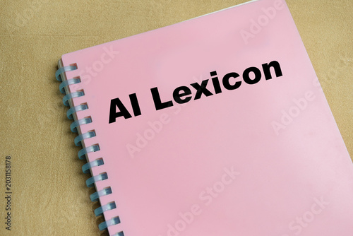 Photos Concept of AI lexicon write on book isolated on Wooden Table