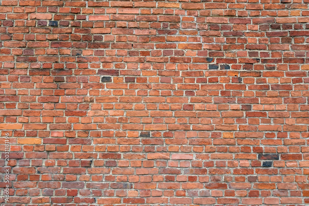 Fototapeta premium Old red brick wall texture background with weathered masonry pattern and rustic architectural surface
