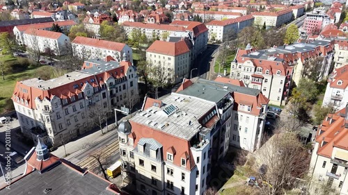 Aerial View of Urban Neighborhood with Red Roof Buildings and Tram Tracks