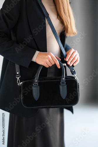 Refined Handbag Presentation Emphasizing Craftsmanship And Glossy Finish In Minimal Setting