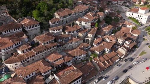 Drone Sideways Tracking Shot Over Historic Ottoman Tile Roofs and White Houses in Berat