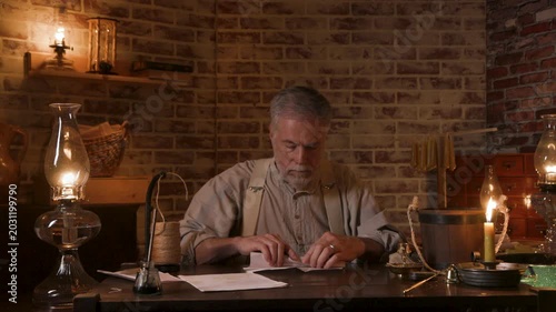 19th century candle maker packaging his candles for sale