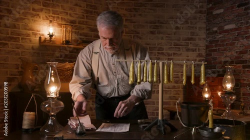 19th century candle maker taking inventory of his candles