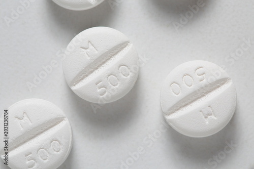 Metformin 500mg tablet type 2 diabetes treatment, white background, up close