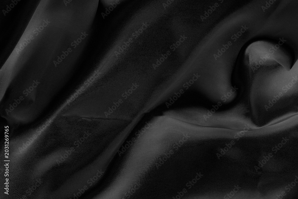 Fototapeta premium Black fabric texture for background; Abstract black fabric cloth wave or wavy folds texture material for background