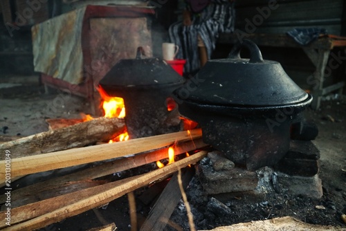 A traditional serabi mold and a clay stove (anglo) heated by firewood. This clay cookware is very popular in various regions of Indonesia.