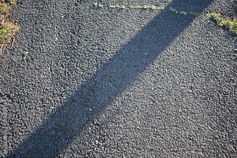Fototapeta premium Abstract asphalt road background with morning light and shadow
