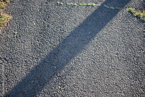 Abstract asphalt road background with morning light and shadow
