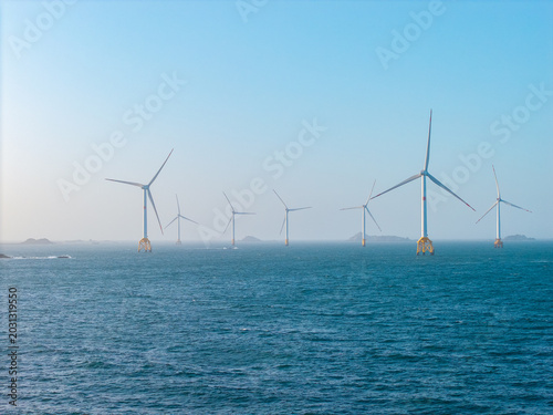 Offshore wind turbines generate renewable energy across the coastal sea waters of Pingtan in Fujian China