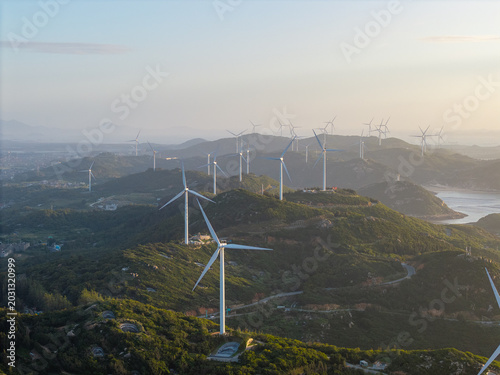 Photography Wind turbines stand across the scenic hills of Pingtan in Fujian China during a