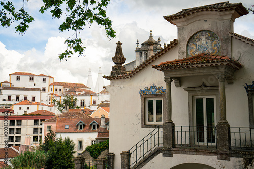 Historic European Townscape with Traditional Architecture, Lush Greenery, and Cloudy Sky. Sintra, Lisbon, Portugal