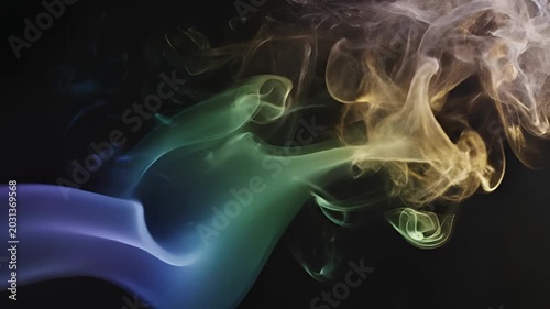 Abstract Colorful Smoke Swirls Against Black Background.