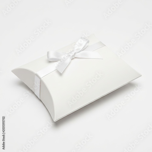 White pillow gift box with ribbon isolated on white background