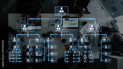 A digital organizational chart showing team members and data visualization, representing business strategies and effective workforce management in an office setting. Raster