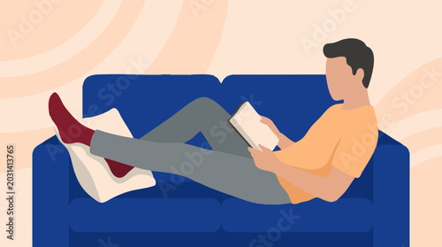 Tableau sur toile Man relaxing and reading a book on a comfortable sofa at home