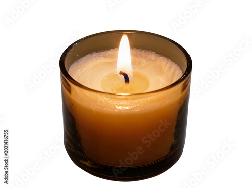 Obraz na plátně Lit amber glass votive candle with creamy wax, isolated on transparent backgroun