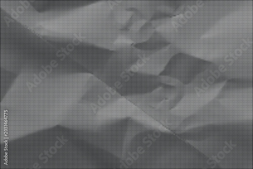 Schilderij op canvas Crinkled gray paper with folds on a flat surface indoors