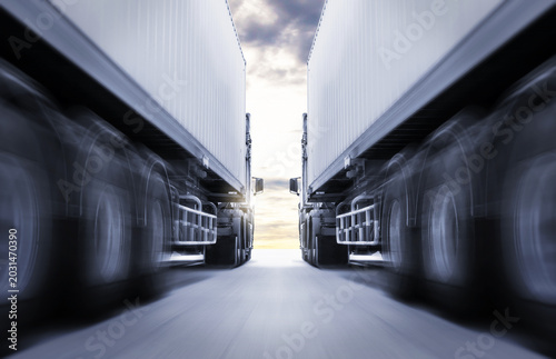Fast Speed of Semi Trailer Truck Driving on The Road. Shipping Cargo Container. Economical Transportation Business. Economy Business Transport on Road. Trucking. Freight Transportation Logistics.	
