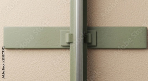 Minimalist Architectural Detail of Green Metal Hardware on Textured Wall