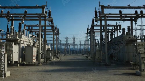 Large industrial electrical substation featuring multiple high voltage transformers, power lines, and transmission towers, distributing energy across a sprawling network
