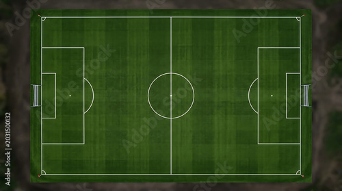 Aerial view of a green soccer field with white lines and goals