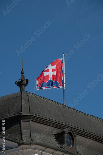 Photography Slovak flag at top of presidential building in Bratislava Slovakia