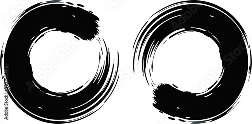 Zen Brush Strokes: Two minimalist ink brush strokes form abstract circular shapes, embodying the essence of Zen and mindfulness. Perfect for conveying calm, simplicity, and artistic expression.