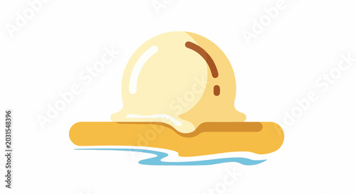 A light yellow scoop of ice cream melting on a tan surface with blue water