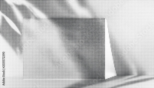 Obraz na płótnie A gray rectangular object sits on a surface with shadows cast upon it
