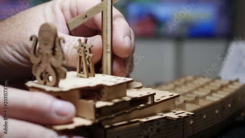 Detailed Wooden 3D Puzzle Ship Construction Closeup. Creative DIY Wooden Steampunk Ship Model Building