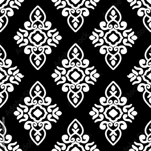 Elegant black and white seamless damask pattern. Classic victorian style motif for textile print, wallpaper background, and luxury fabric design. Symmetrical monochrome geometric ornament.