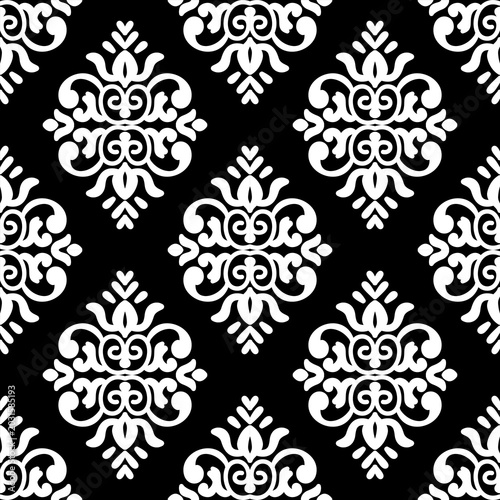 Elegant black and white seamless damask pattern. Classic victorian style motif for textile print, wallpaper background, and luxury fabric design. Symmetrical monochrome geometric ornament.