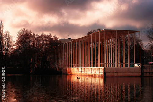 This is a modern open air building in a public park on a cloudy winter afternoon.