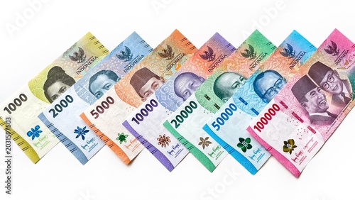 фотографія Colored Indonesian rupiah banknotes of various denominations on a light background