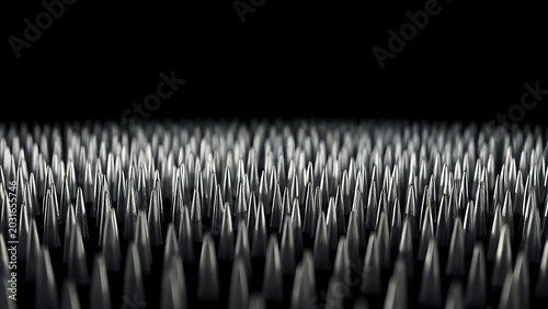 A field of sharp silver line tips densely arranged against a black background.