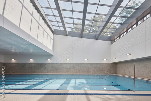 Modern fitness, sports, or indoor swimming pool facility with clean architectural design
