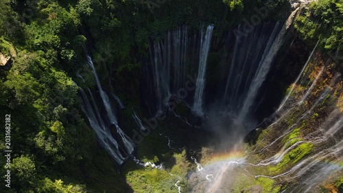 Stunning 4K aerial view of Tumpak Sewu waterfall curtains in East Java, Indonesia.