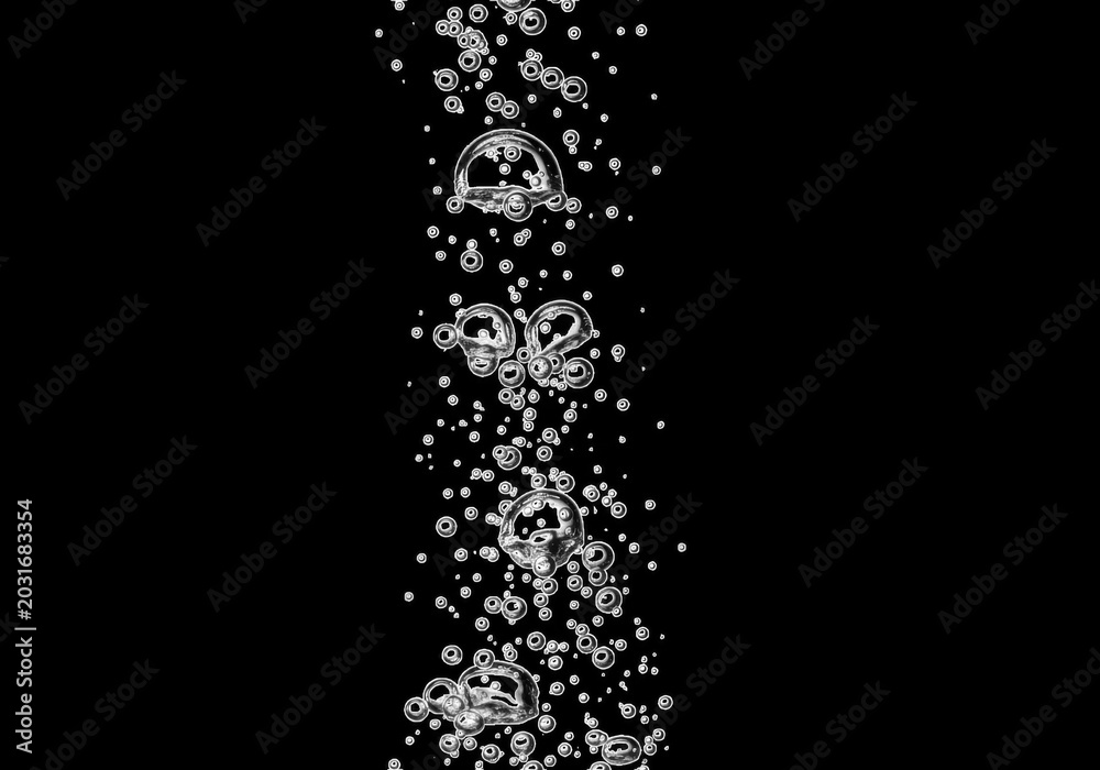 Obraz premium A vertical stream of transparent air bubbles rising against a solid black background, showing various sizes of spherical gas pockets