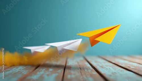 Yellow paper airplane flies ahead of white ones on wood. Success and leadership in business. Moving forward with strategy and vision. Unique direction with competitive edge.