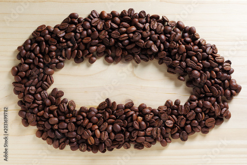 Coffee beans frame on wooden background