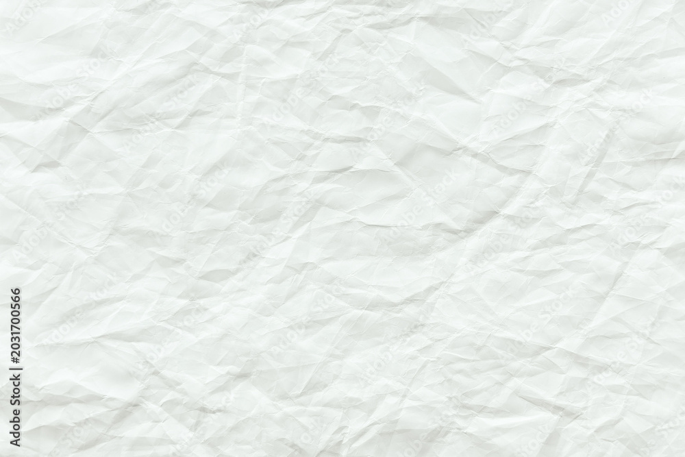 Naklejka premium Crumpled white paper texture with visible creases and folds.