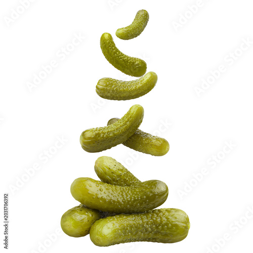 Pickled cucumbers gherkins falling composition, isolated on cutout transparent background
