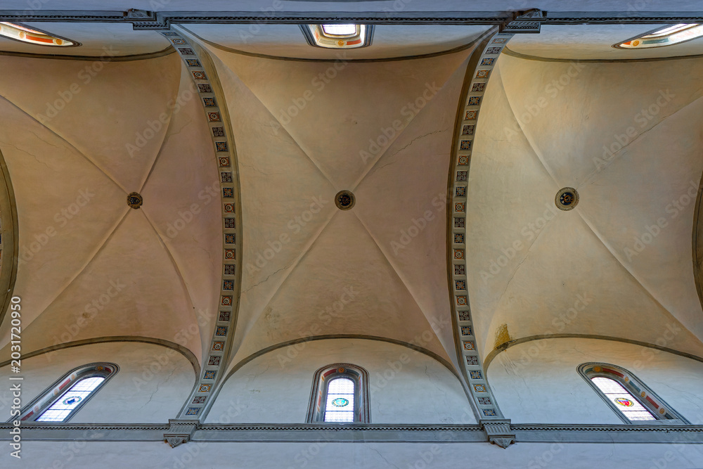 Naklejka premium SIENA, ITALY, April 25, 2026 : Roofs of San Clemente in Santa Maria dei Servi basilica