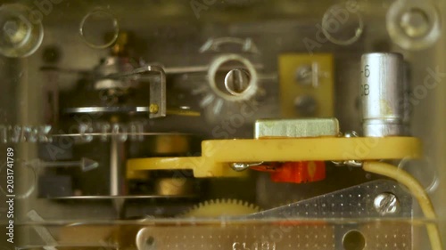 Internal mechanical components of vintage electronic device with wires and capacitors