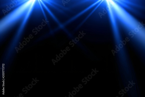 Twin Blue Spotlights Shining Down on Black Background

