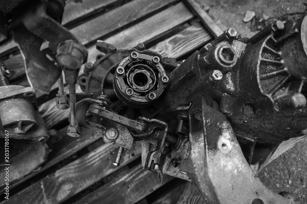 Fototapeta premium old car gearbox dirty from a front-wheel drive car dismantled for repair 