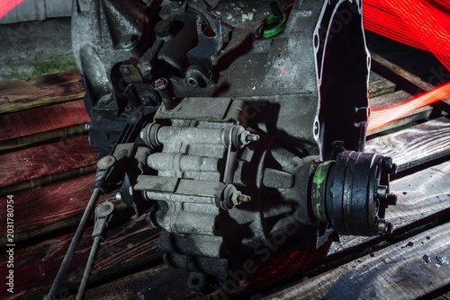 old car gearbox dirty from a front-wheel drive car dismantled for repair
