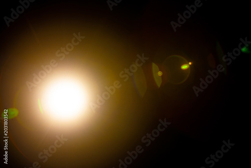Sun flare on the black background