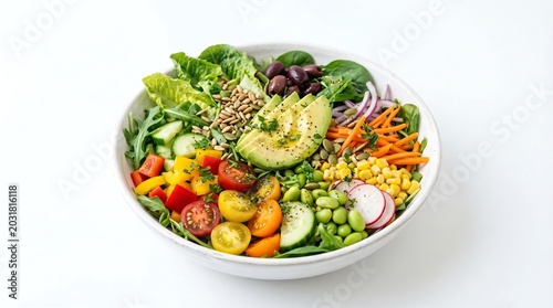 Fresh vibrant salad bowl featuring sliced avocado with colorful assorted raw garden vegetables and seeds in a white ceramic dish captured in this bright and clean professional studio food photograph.